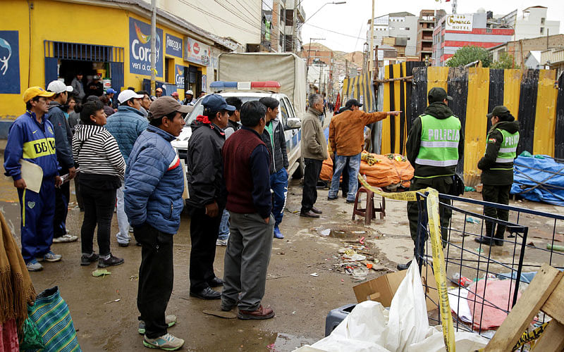 People gather next to the site where a new explosion occurred in Oruro, Bolivia, on 14 February 2018. Reuters  2 explosions kill 12 in Bolivia