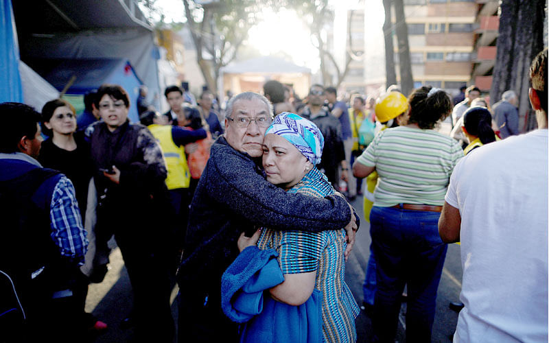 People react after an earthquake shook buildings in Mexico City, Mexico on 16 February 2018. Reuters