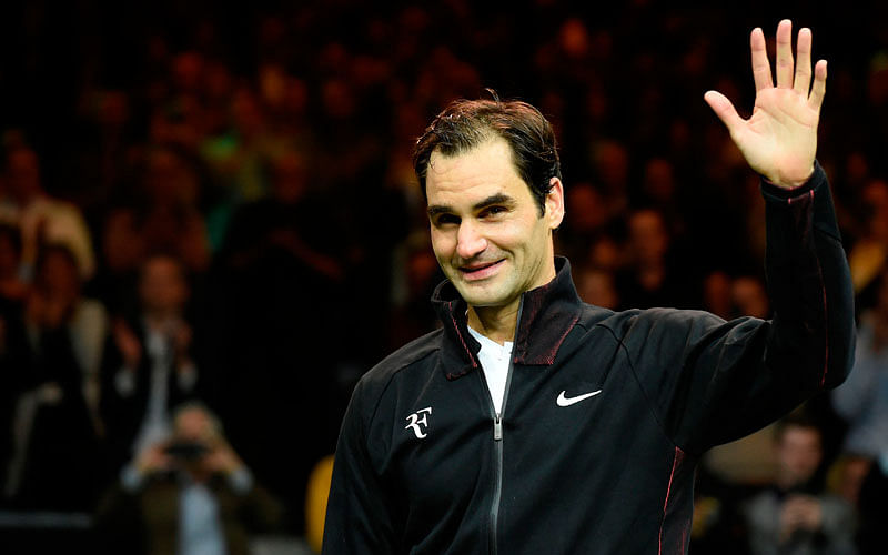 Switzerland`s Roger Federer waves as he celebrates after victory over Netherlands Robin Haase in their quarter-final singles tennis match for the ABN AMRO World Tennis Tournament in Rotterdam on 16 February 2018. AFP