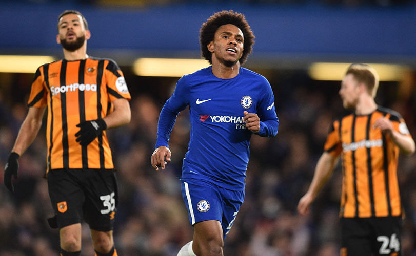 Chelsea’s Brazilian midfielder Willian © celebrates scoring the team’s third goal during the English FA Cup fifth round football match between Chelsea and Hull City at Stamford Bridge in London on Friday. Photo: AFP