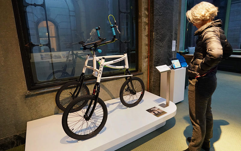 A woman looks at an Afari, an outdoor mobility aid for jogging, running and walking on diverse terrain, which is displayed as part of the Access+Ability exhibit at the Cooper Hewitt Smithsonian Design Museum on 8 February 2018 in New York. Photo: AFP
