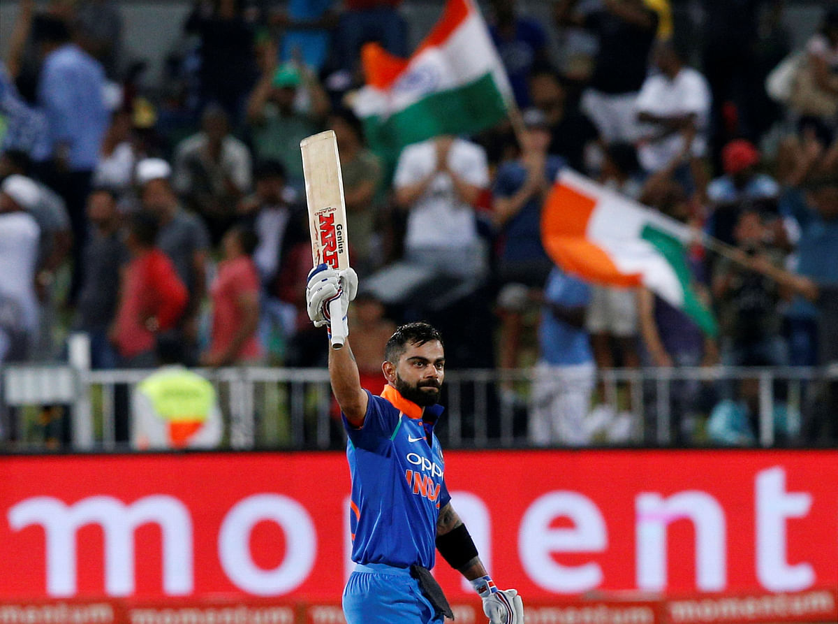 India's Virat Kohli celebrates scoring a century. Photo: Reuters