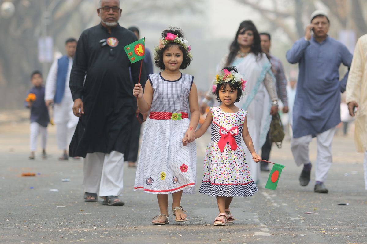 Children with their parents went to National Shaheed Minar to pay tribute to language heroes on 21 February. Photo: Syful Islam
