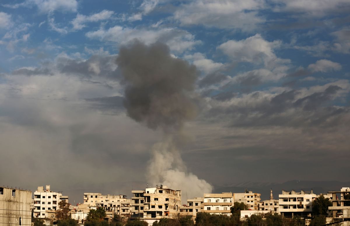 Smoke rises from buildings in Kafr Batna following Syrian government bombardments on the besieged Eastern Ghouta region on the outskirts of the capital Damascus on Wednesday. Photo: AFP