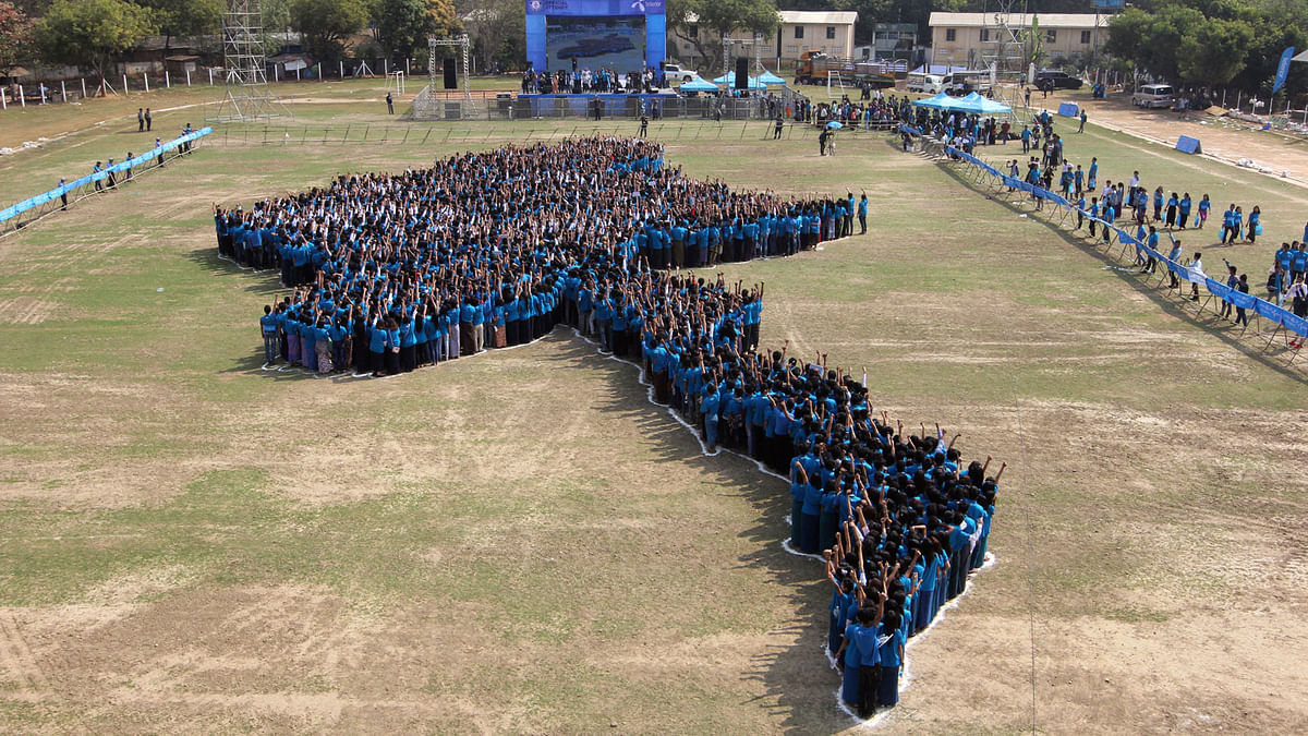 People stand as they participate during an official attempt to break Guinness World Record, with 3400 people making giant human map of Myanmar organized by Telenor, in Magway. Photo: Reuters