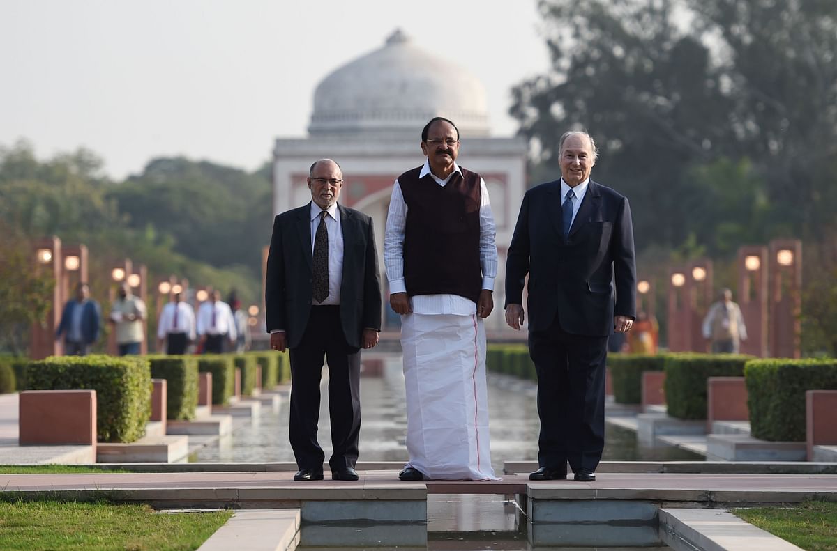 Indian Vice-President Venkaiah Naidu (C), Lieutenant Governor of Delhi Anil Baijal (L) and Prince Karim Aga Khan IV (R) pose for a photograph during the inauguration of Sunder Nursery, a 16th-century heritage garden complex adjacent to Indian UNESCO site Humayun's Tomb, in New Delhi on 21 February 2018. AFP