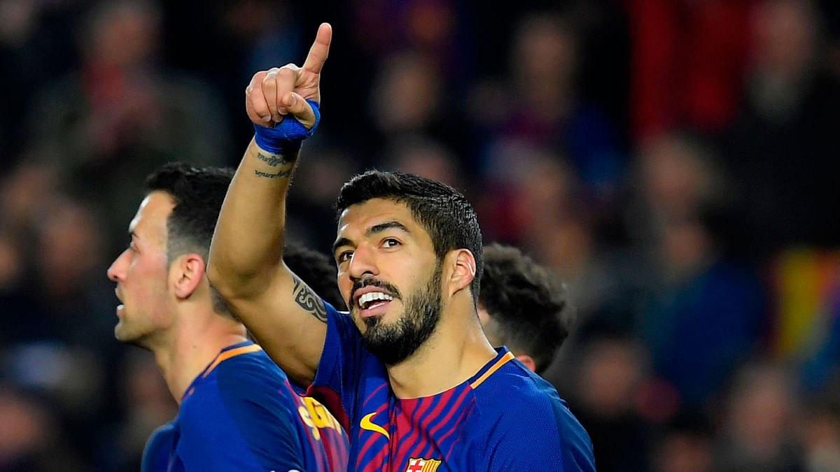 Barcelona’s Uruguayan forward Luis Suarez celebrates after scoring during the Spanish league football match between FC Barcelona and Girona FC at the Camp Nou stadium in Barcelona on Saturday. Photo: AFP