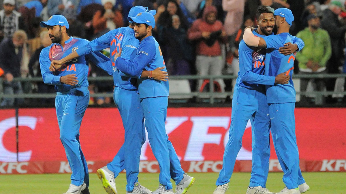 India’s players celebrate after winning the third T20 cricket match between India and South Africa at the Newlands Cricket Ground on Saturday. Photo: AFP