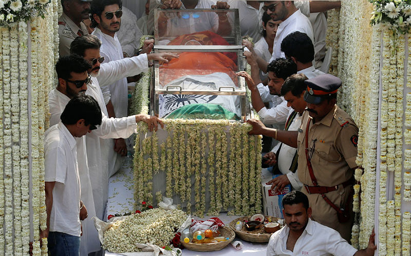 Friends and family members stand next to the body of Bollywood actress Sridevi draped in Indian national flag during her funeral procession in Mumbai, India on 28 February 2018. Photo: Reuters