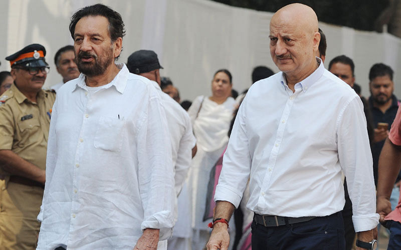 Indian actor Anupam Kher (R) and film director Shekhar Kapoor (L) attend the funeral of late Bollywood actress Sridevi Kapoor in Mumbai on 28 February 2018. Photo: AFP