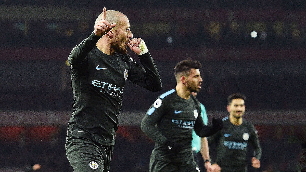 Manchester City midfielder David Silva celebrates after scoring their second goal against Arsenal. AFP