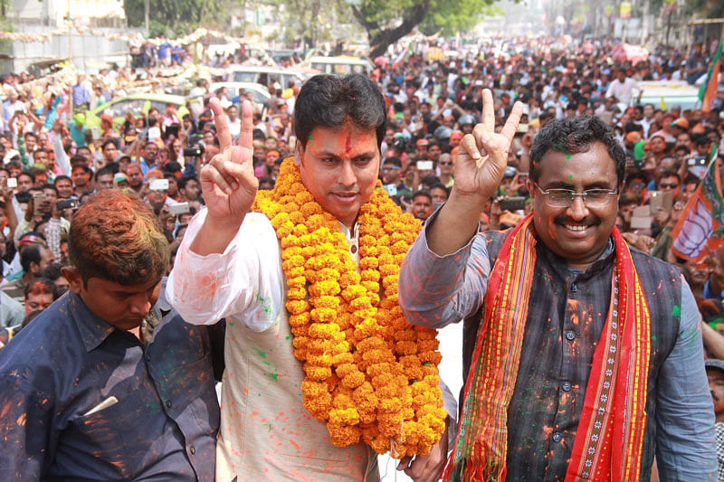 Tripura BJP president Biplab Kumar Deb along with the party`s National General Secretary Ram Madhav celebrate the party`s performance in the recently concluded Tripura assembly elections, in Agartala on 3 March 2018. Photo: IANS