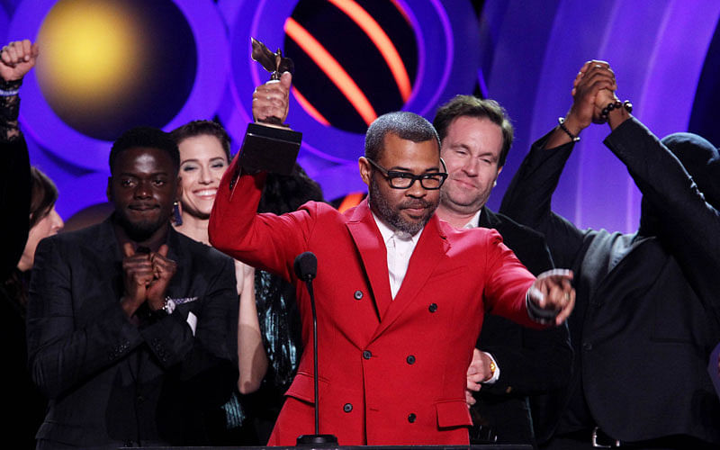 Actor/writer/director Jordan Peele (C) accepts Best Feature for `Get Out` during the 2018 Film Independent Spirit Awards on 3 March, 2018 in Santa Monica, California. Photo: AFP
