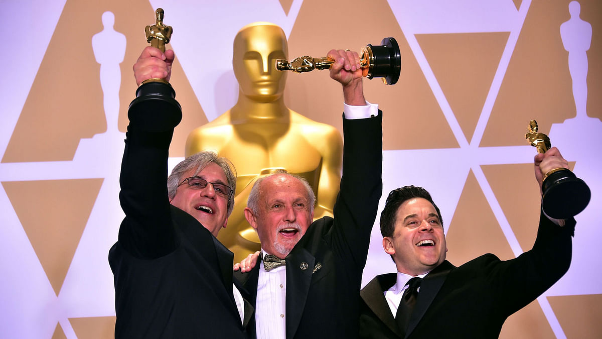 Sound mixers Mark Weingarten, Gary A. Rizzo and Gregg Landaker, winners of the Best Sound Mixing award for `Dunkirk,` pose in the press room during the 90th Annual Academy Awards on 4 March, 2018, in Hollywood, California. Photo: AFP