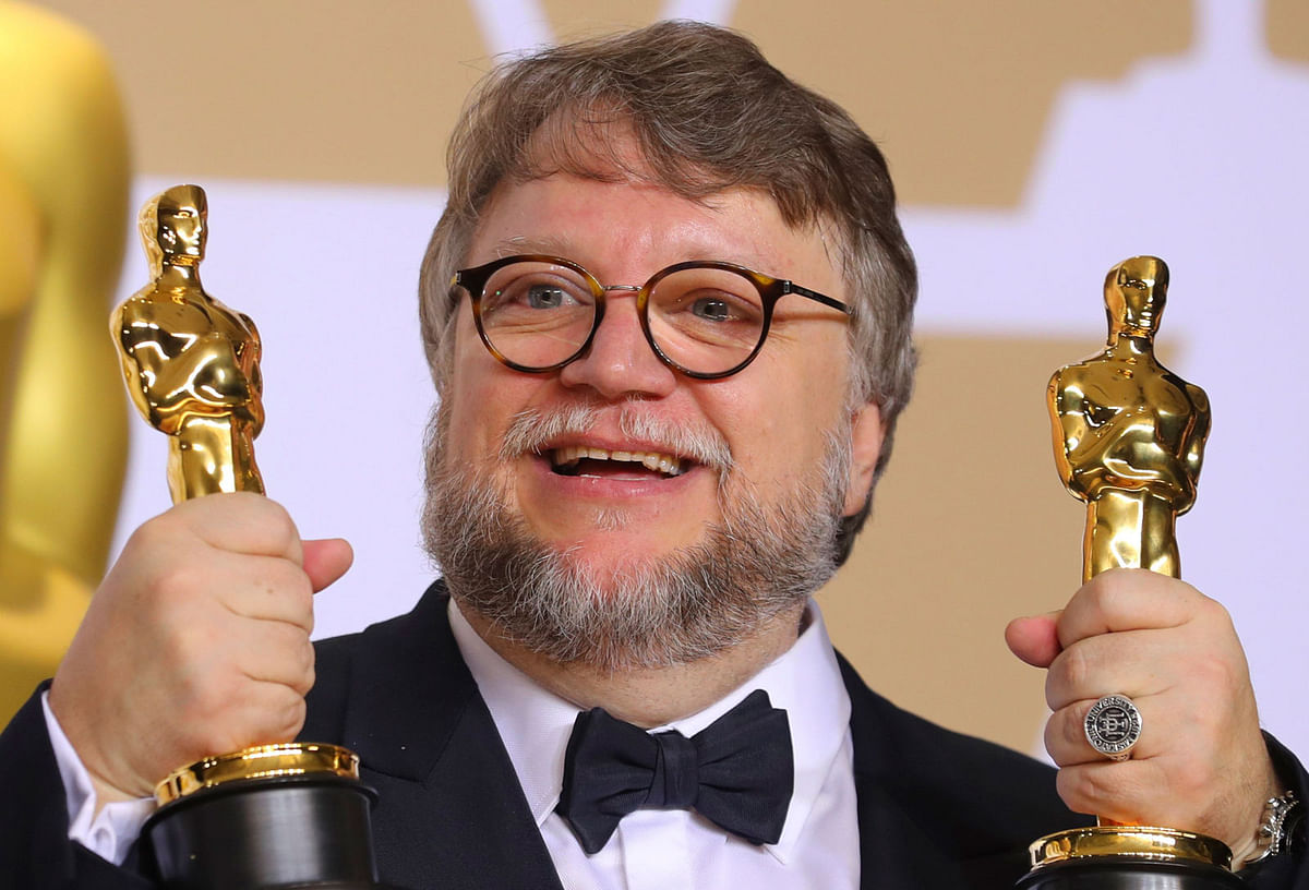 Guillermo del Toro with the Best Director Award and the Best Picture Award for `The Shape of Water. Photo: Reuters