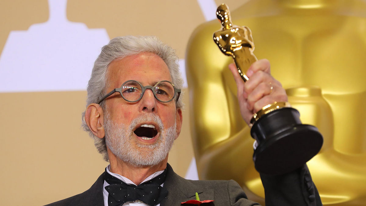 Frank Stiefel holds the Oscar for Best Documentary Short `Heaven is a Traffic Jam on the 405`. Photo: Reuters