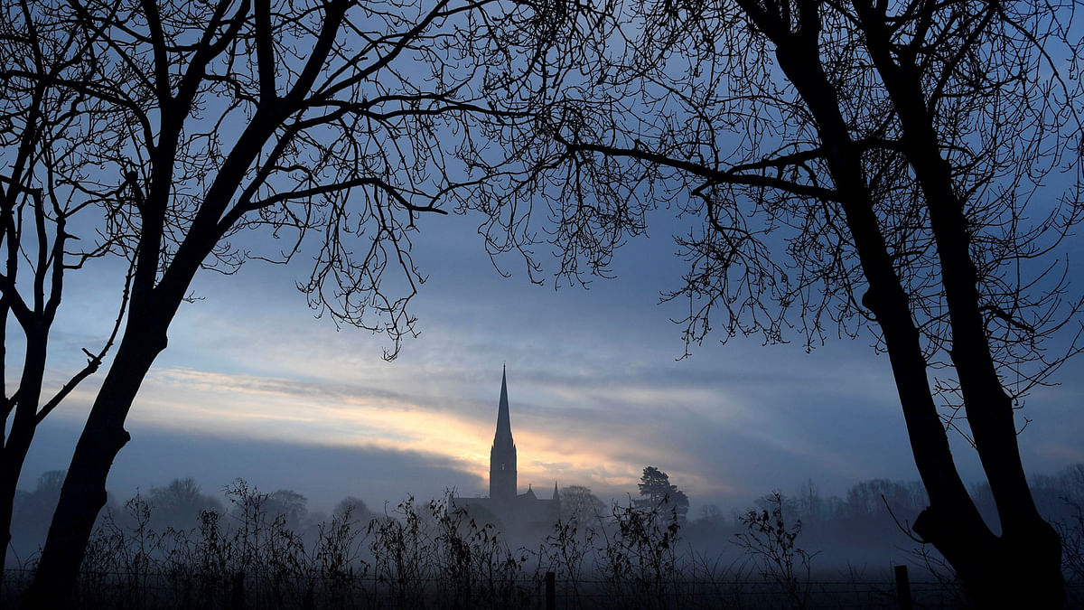 Salisbury Cathedral, in the centre of the city in which former Russian intelligence officer Sergei Skripal and a woman were found unconscious after they had been exposed to an unknown substance is seen at dawn in Salisbury on 7 March. Reuters
