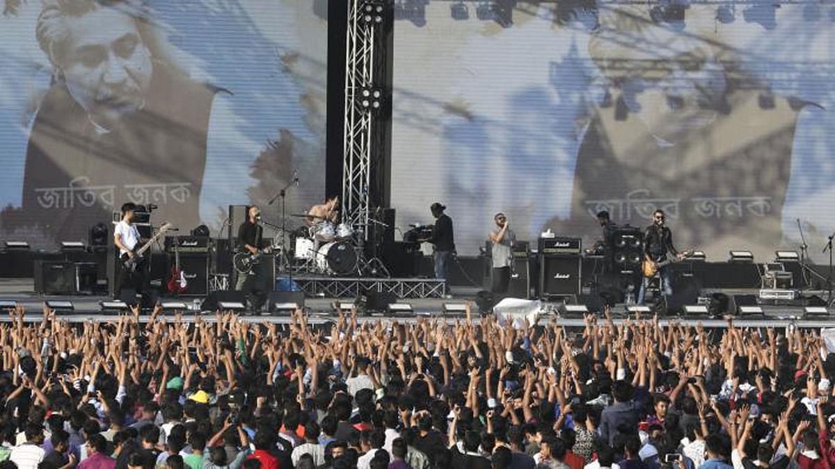 Spectators cheer at Army stadium in Dhaka as the local rock band Arbovirus performs. The concert was organised by Young Bangla, a youth platform on 7 March. Photo: Dipu Malakar