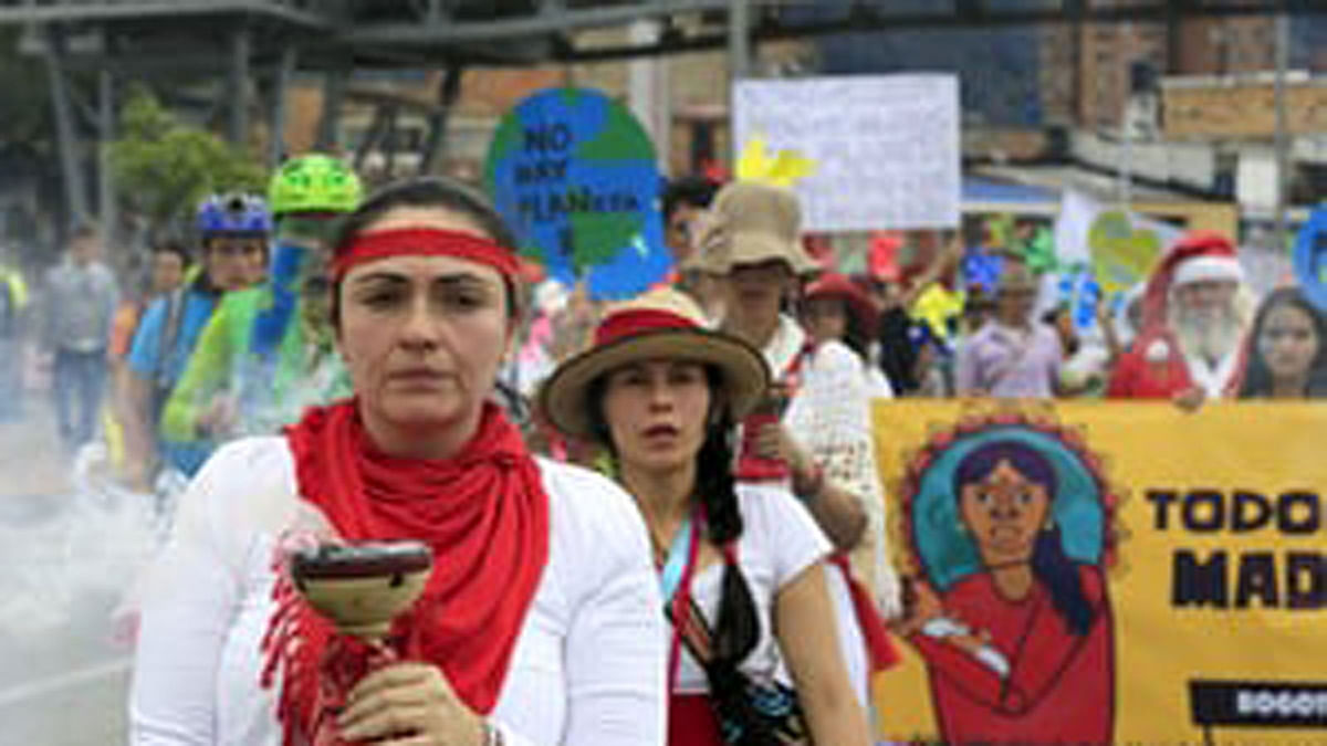 Women activists march ahead of the 2015 Paris Climate Change Conference in Bogota, Colombia. Reuters