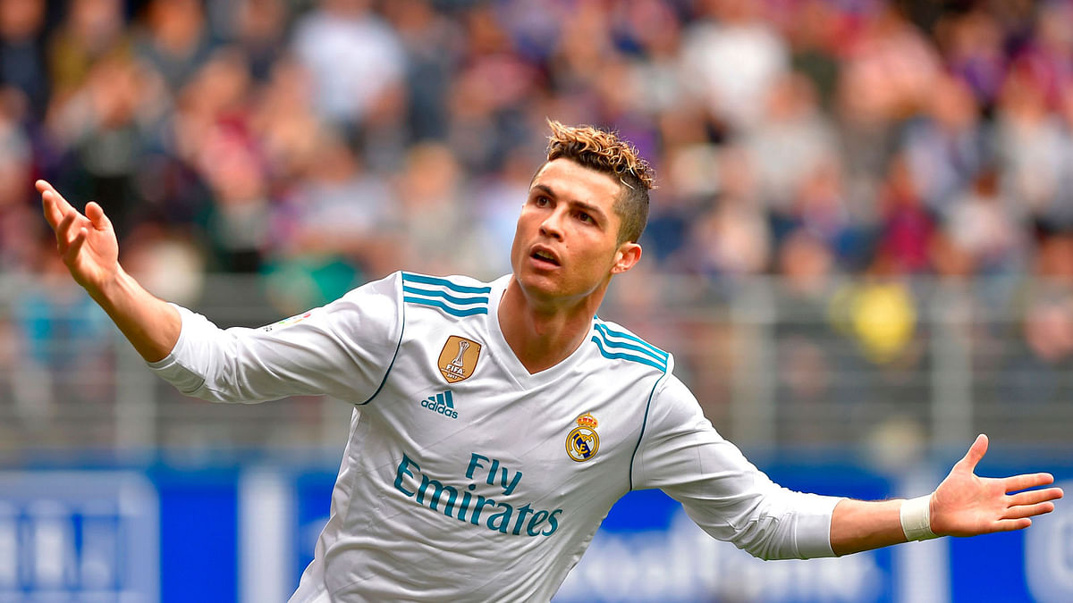 Real Madrid`s Portuguese forward Cristiano Ronaldo celebrates after scoring a goal during the Spanish league football match between Eibar and Real Madrid at the Ipurua stadium in Eibar on 10 March. Photo: AFP