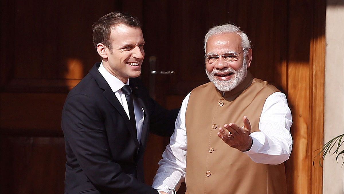 India`s Prime Minister Narendra Modi met French President Emmanuel Macron as he arrives to attend the International Solar Alliance Founding Conference in New Delhi, India  Photo : Reuters