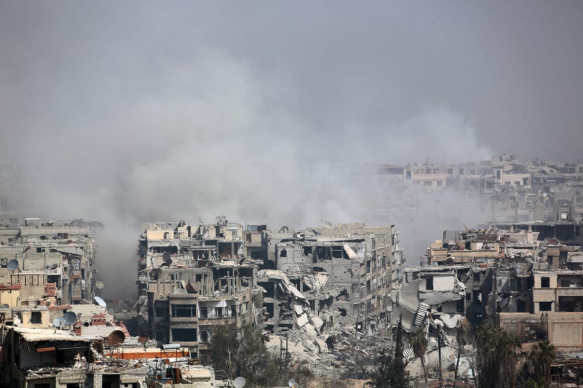 Smoke billows following Syrian government bombardment on the rebel-held besieged town of Harasta, in the Eastern Ghouta region on the outskirts of Damascus on Monday. Photo: AFP