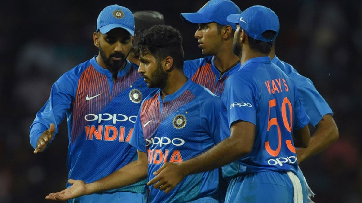 Indian cricketer Shardul Thakur (C) celebrates with teammates after dismissing Sri Lankan batsman DushmanthaChameera. AFP