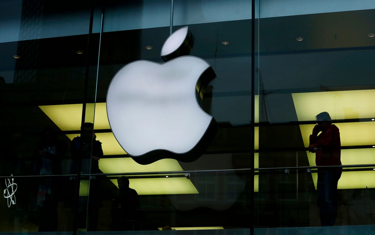 Activists from the anti-globalisation organisation Attac protest against alleged tax evasion by Apple company in front of an Apple store in Frankfurt. Photo: Reuters
