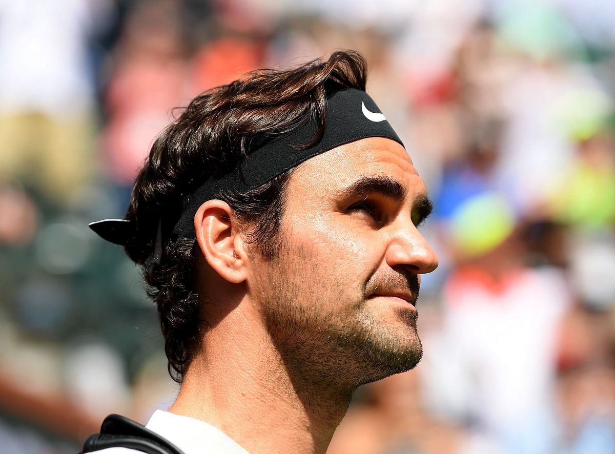 Roger Federer of Switzerland enters the court before his match against Filip Krajinovic of Serbia during the BNP Paribas Open at the Indian Wells Tennis Garden on Monday. Photo: AFP