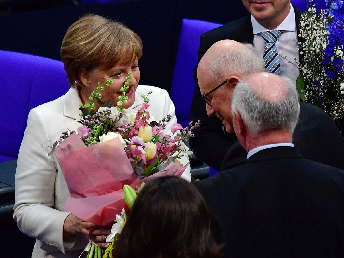 German Chancellor Angela Merkel (L). AFP