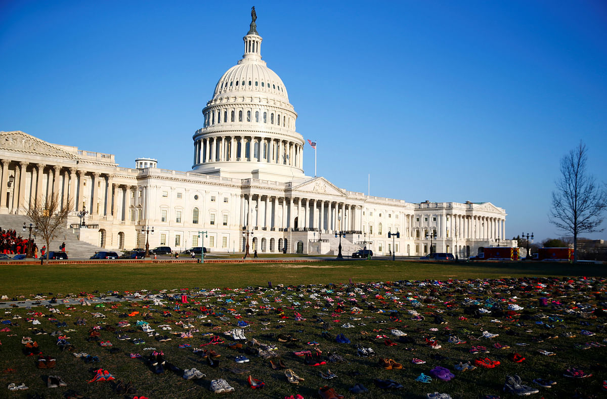 Activists install 7000 shoes on the lawn in front of the U.S. Capitol on Capitol Hill in Washington, US 13 March 2018. Organizers said the installation represents the number of lives lost since the shooting at Sandy Hook elementary in Newtown, Connecticut. The Sandy Hook shooting in Newtown, Connecticut, took place less than six years ago, in which 26 people were killed - 20 of whom were young children. Photo: Reuters