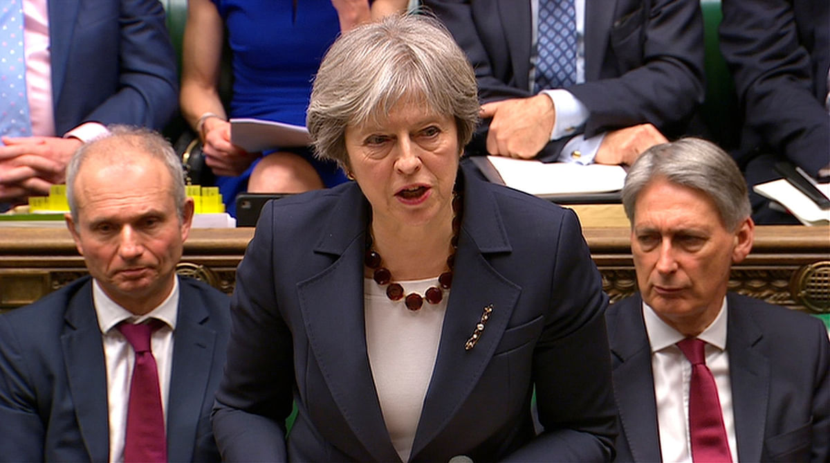 Britain`s prime minister Theresa May addresses the House of Commons on her government`s reaction to the poisoning of former Russian intelligence officer Sergei Skripal and his daughter Yulia in Salisbury, in London, on 14 March 2018. Reuters