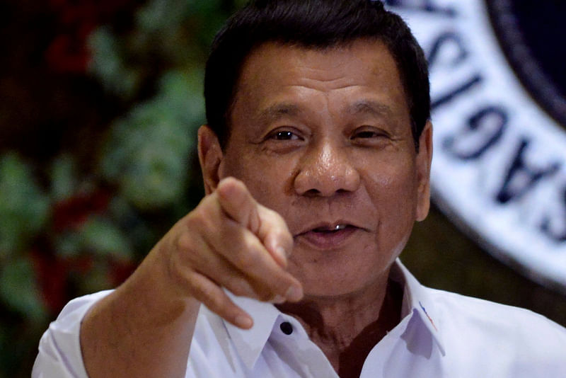 This file photo shows Philippine president Rodrigo Duterte pointing to photographers during a ceremony at the Malacanang Palace in Manila, Philippines in 2016. Philippine has recently announced to withdraw from the International Criminal Court (ICC). Reuters