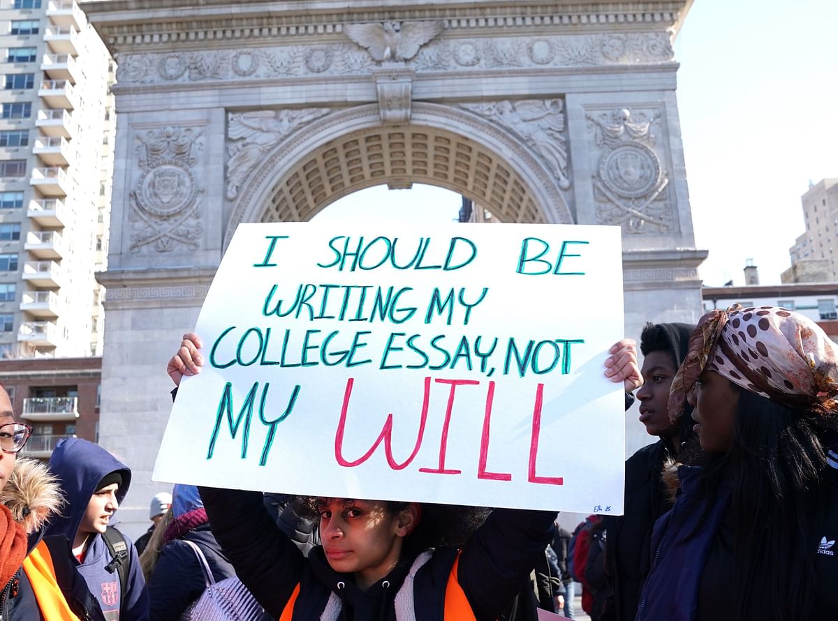 Students from Harvest Collegiate High School stand in Washington Square Park on Wednesday in New York to take part in a national walkout to protest gun violence, one month after the shooting in Parkland, Florida, in which 17 people were killed. Photo: AFP