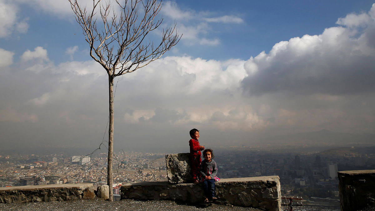 Children play near their house on a hilltop overlooking Kabul, Afghanistan 14 March 2018. Reuters
