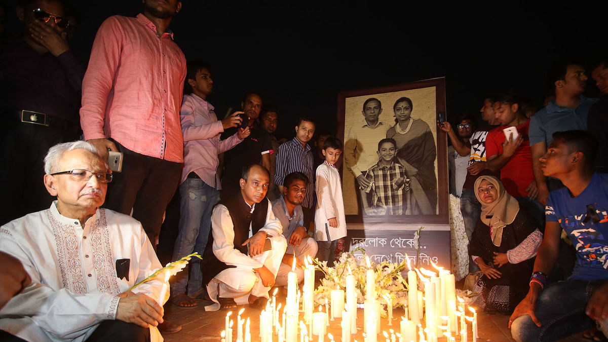 A candle-light vigil observed in memory of US-Bangla plane crash victims including Sanzida Haque and her husband Rafiquz Zaman and their child Aniruddha Zaman at Manik Mia Avenue in Dhaka on 15 March. Photo: Abdus Salam.