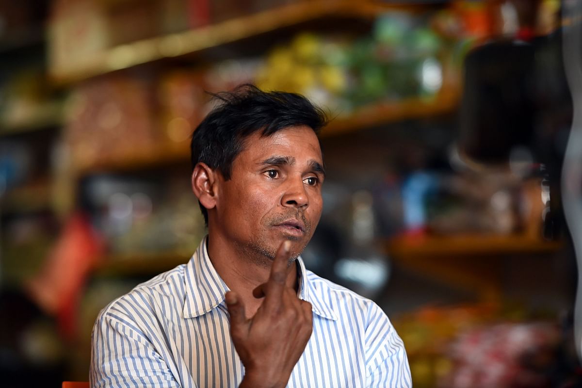 This picture taken on 6 March 2018 shows Rohingya refugee Kobir Ahmed talking to AFP during an interview in Melbourne. Kobir helps run a grocery store in suburban Australia where he lives in a small community of Rohingya, the persecuted Muslim minority who have fled army-led violence in Myanmar`s Rakhine state in their hundreds of thousands. AFP