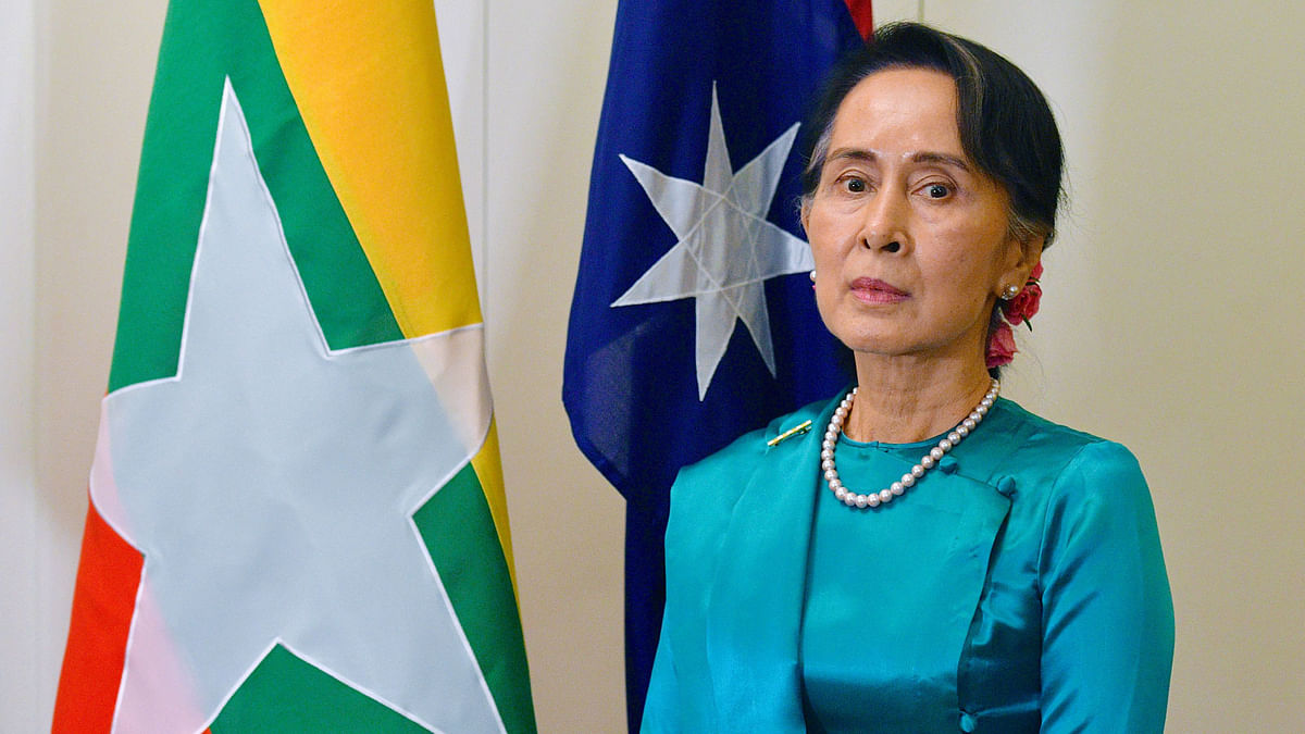 Myanmar`s State Counsellor Aung San Suu Kyi stands next to national flags of Australia and Myanmar at Parliament House in Canberra, Australia on 19 March. Photo: Reuters