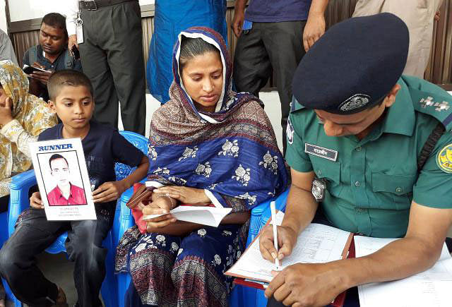 Sultana providing information about her husband to police. Photo: Prothom Alo