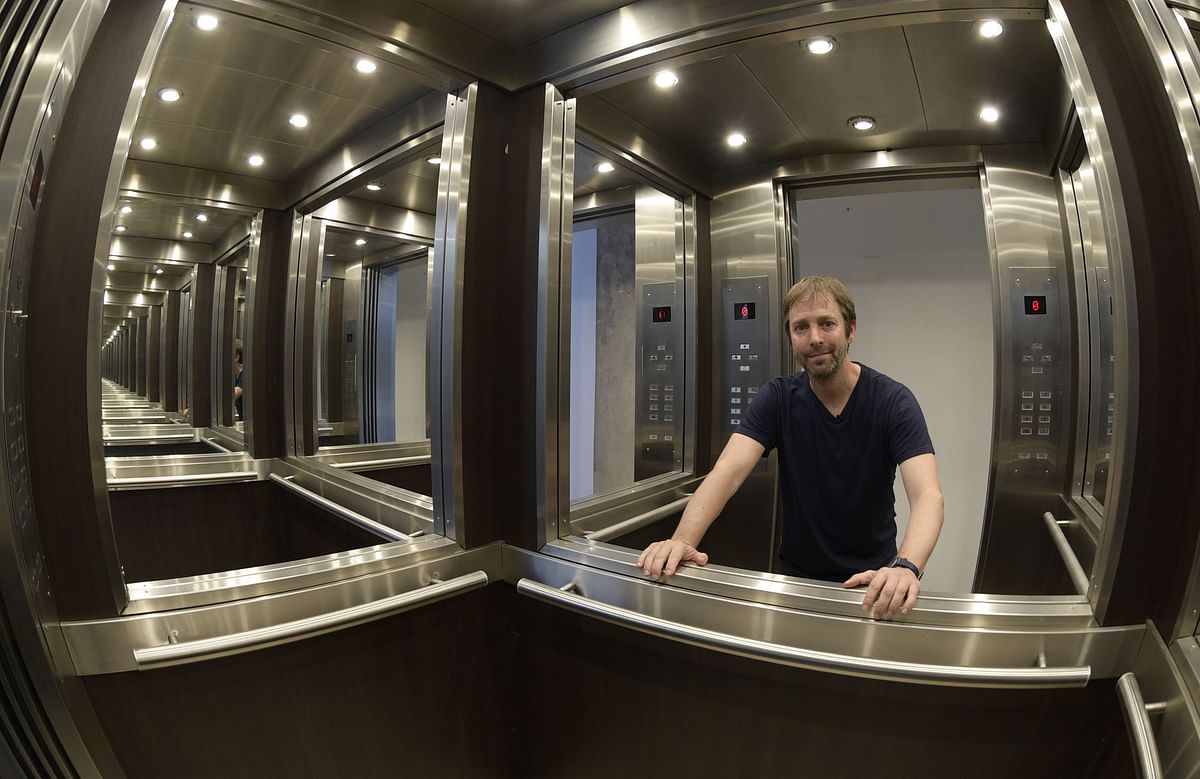 Argentine conceptual artist Leandro Erlich poses inside his artwork `Elevator Maze, 2011` at his studio in Buenos Aires on 9 March 2018. Leandro Erlich, is the Argentine conceptual artist of greater international projection nowadays, his installations have travelled to museums in Latin America, Europe, Asia and the United States. Photo: AFP