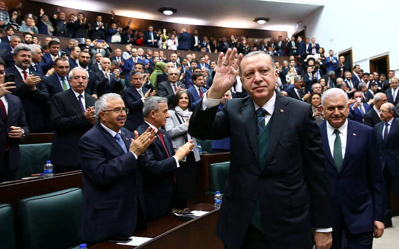Turkish President Tayyip Erdogan greets members of the parliament from his ruling AK Party during a meeting in Ankara Turkey 20 March 2018. Photo: Reuters