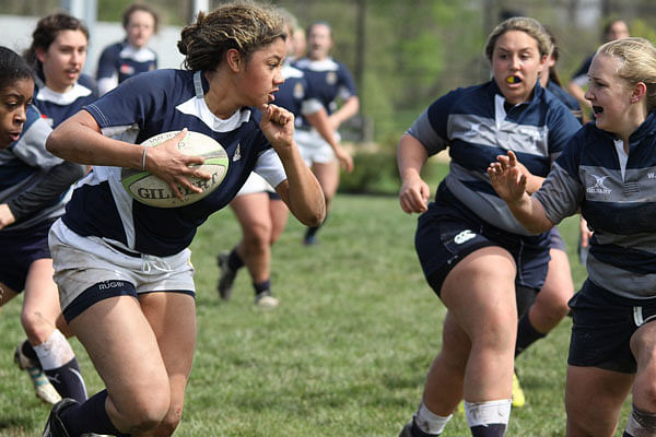 Women playing rugby. Photo: Collected