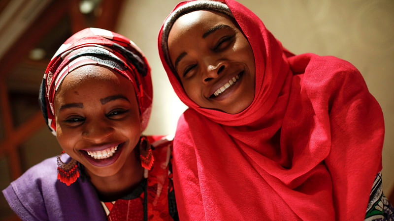 Hauwa (L) and Ya kaka, identified only by their first names, former captives of Boko Haram militants in Nigeria and now acting as advocates speaking out on behalf of other captives and survivors, pose for a portrait after they appeared on a panel dealing with issues of violence against women in New York City, US on 13 March. Photo: Reuters