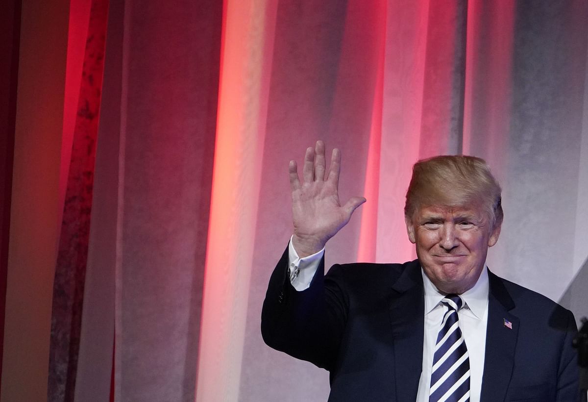 US President Donald Trump waves as he arrives to speak at the National Republican Congressional Committee March Dinner at the National Building Museum on Tuesday. Photo: AFP