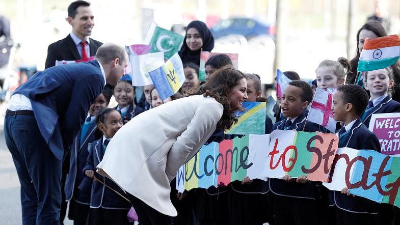 Britain`s Prince William and Catherine, Duchess of Cambridge talk to local children as they arrive at a SportsAid event at the Copper Box in the Olympic Park in Stratford, London, Britain, on 22 March 2018. Reuters