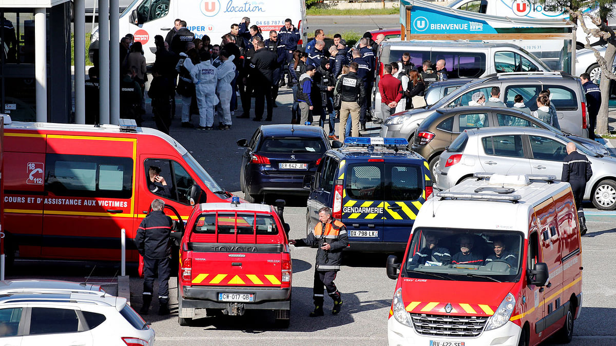A general view shows rescue forces and police officers at a supermarket after a hostage situation in Trebes, France, 23 March, 2018. Photo: Reuters