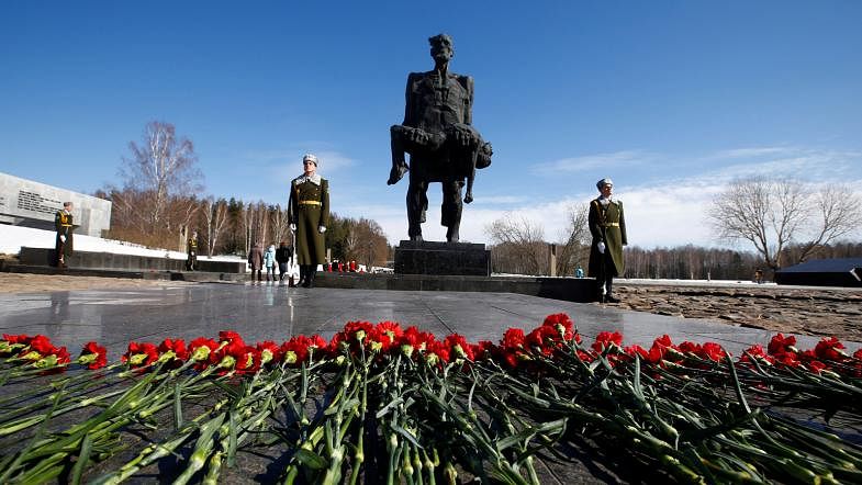 Belarussian honour guards stand at the World War Two memorial in the former village of Khatyn, Belarus, on 22 March 2018. Nazi troops killed 149 villagers on 22 March 1943, most of them children and women, and burned down their houses and the village was never restored again, according to historians. Reuters