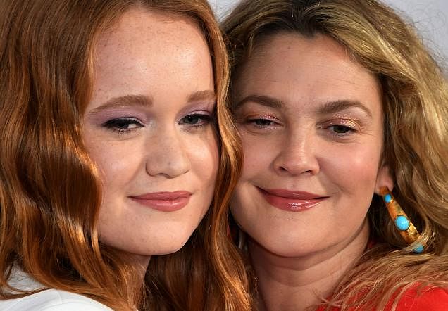 Liv Hewson (L) and Drew Barrymore arrive on the red carpet for Netflix`s `Santa Clarita Diet` season 2 premiere at The Dome Arclight in Hollywood, California on 22 March 2018. AFP