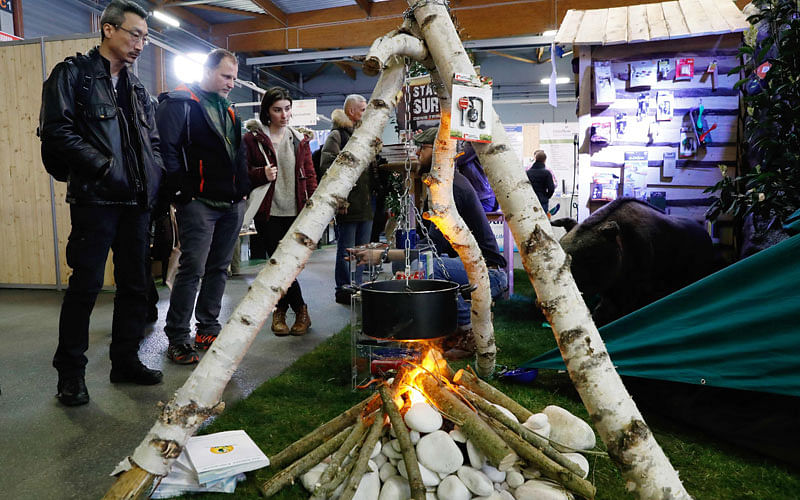 People visit survival training stand at the Survival Expo on 23 March in Paris. Photo: AFP