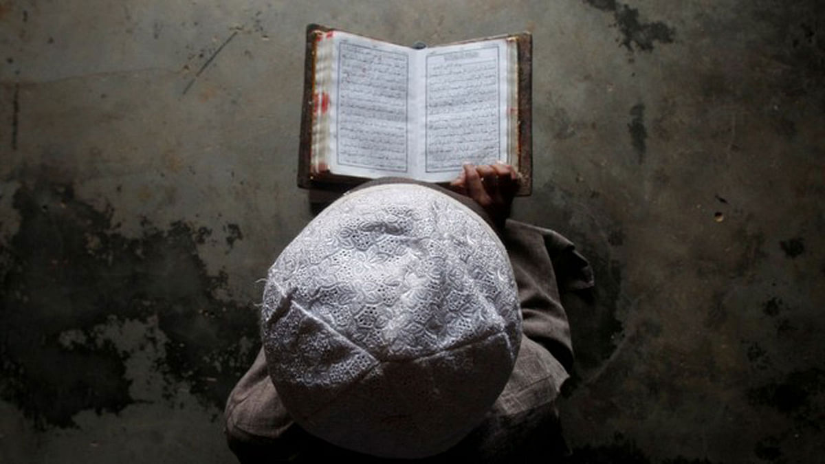 A Muslim boy learns to read the Koran at a madrassa, or religious school on the outskirts of Agartala, India File photo : Reuters